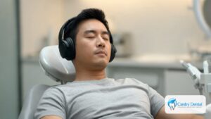 Relaxed patient wearing headphones in a dental chair at a Reseda dental office
