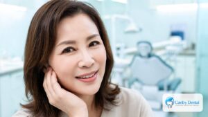 Calm woman resting her hand along her jawline, relaxed jaw muscles