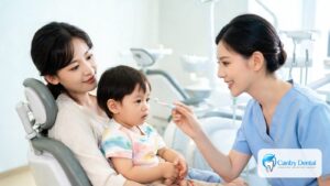 Toddler on a parent's lap at a first dental visit in a family dental office in Reseda